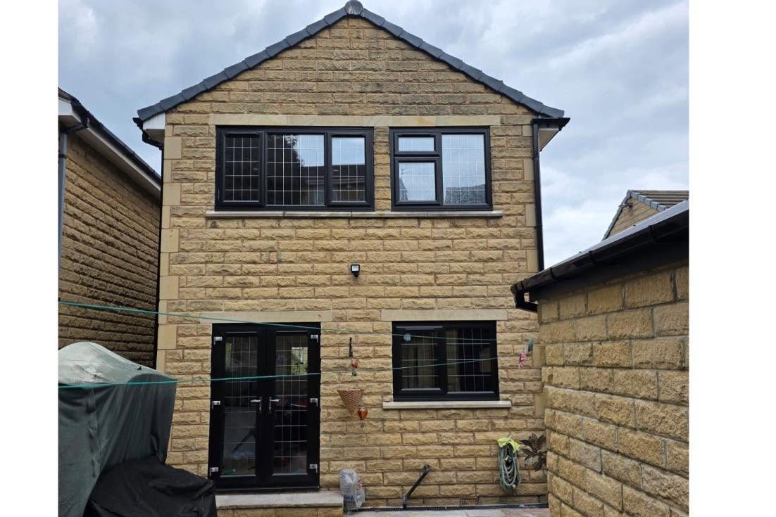Full rear transformation with anthracite windows and French doors
